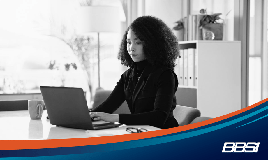 business owner using an AI platform such as ChatGPT to improve the efficiency of her small business.