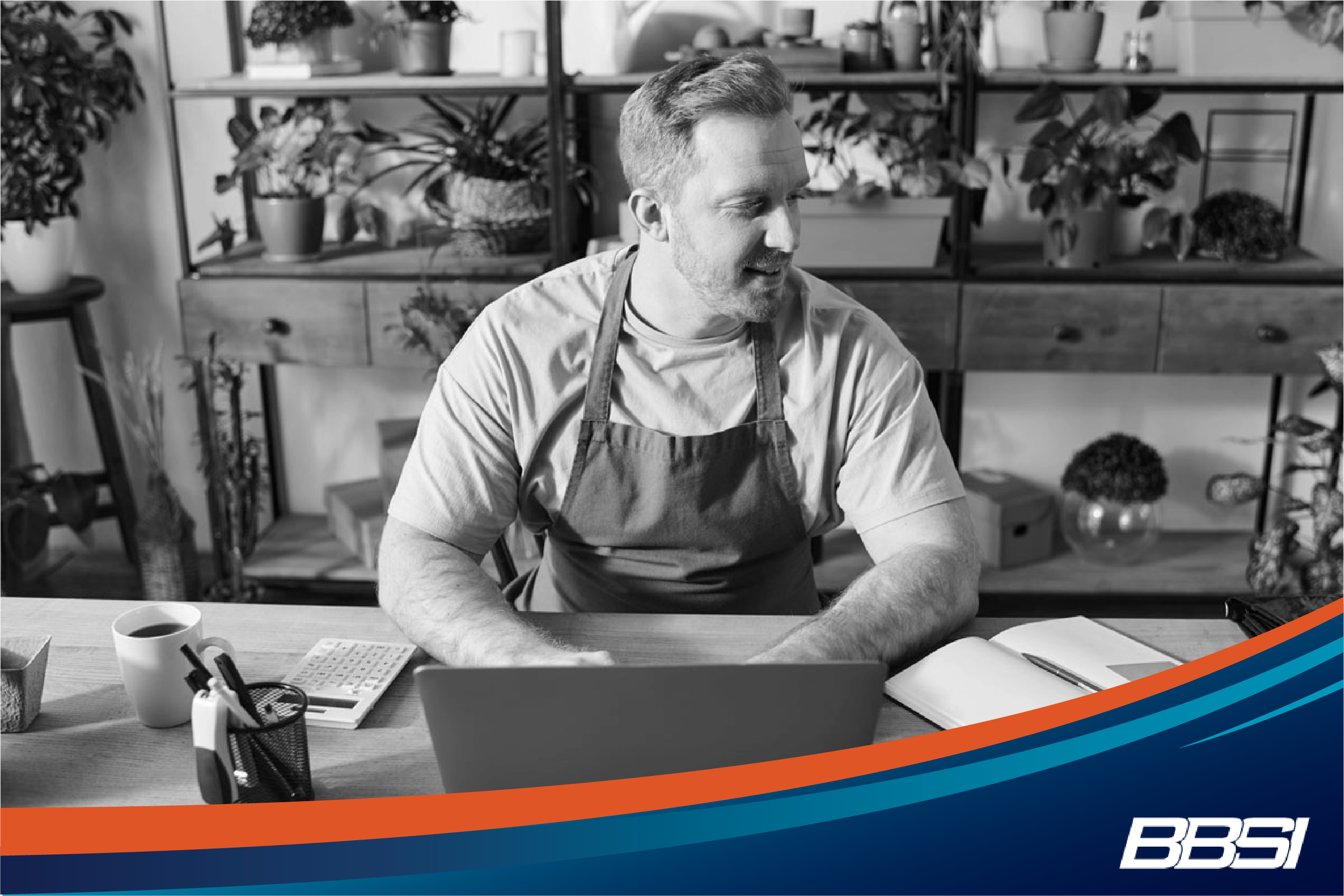 Small business owner on computer researching what a PEO stands for