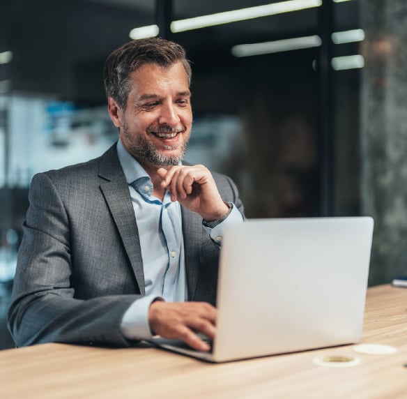 Business executive on a virtual call in a conference room.