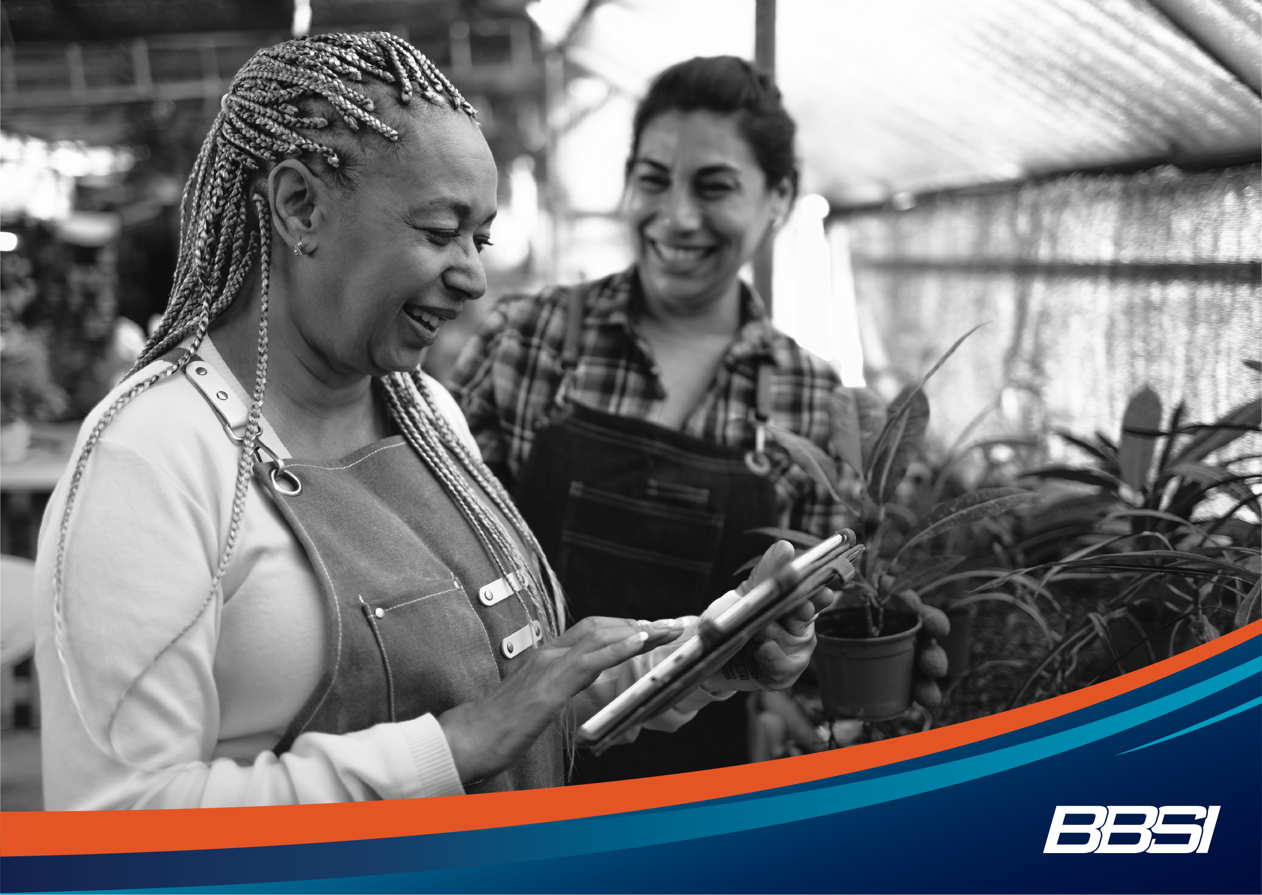 two female gardeners working together to plan for their seasonal business