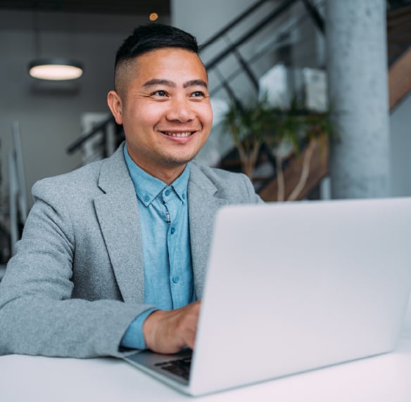 An insurance broker advising a client in an office.
