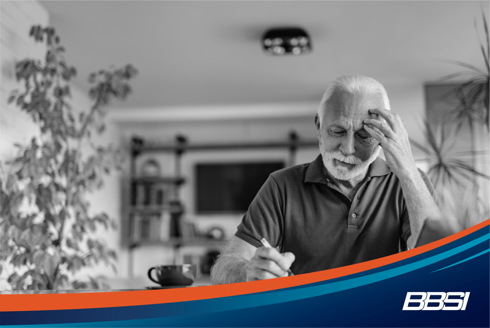 Man looking frustrated reviewing his payroll checking for and payroll mistakes