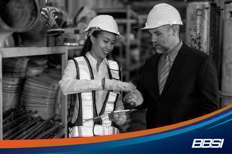 a factory worker meeting with an HR business partner
