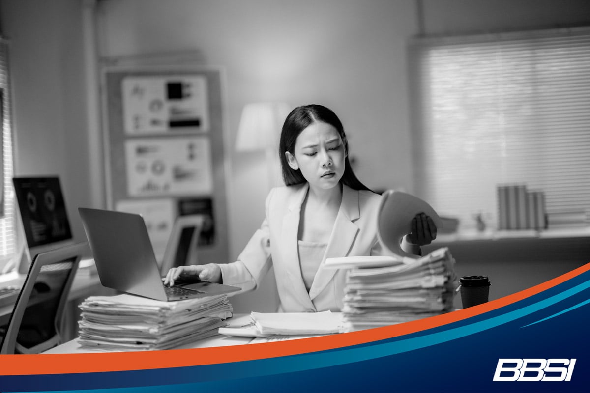 Business woman trying to stay on top of her HR tasks
