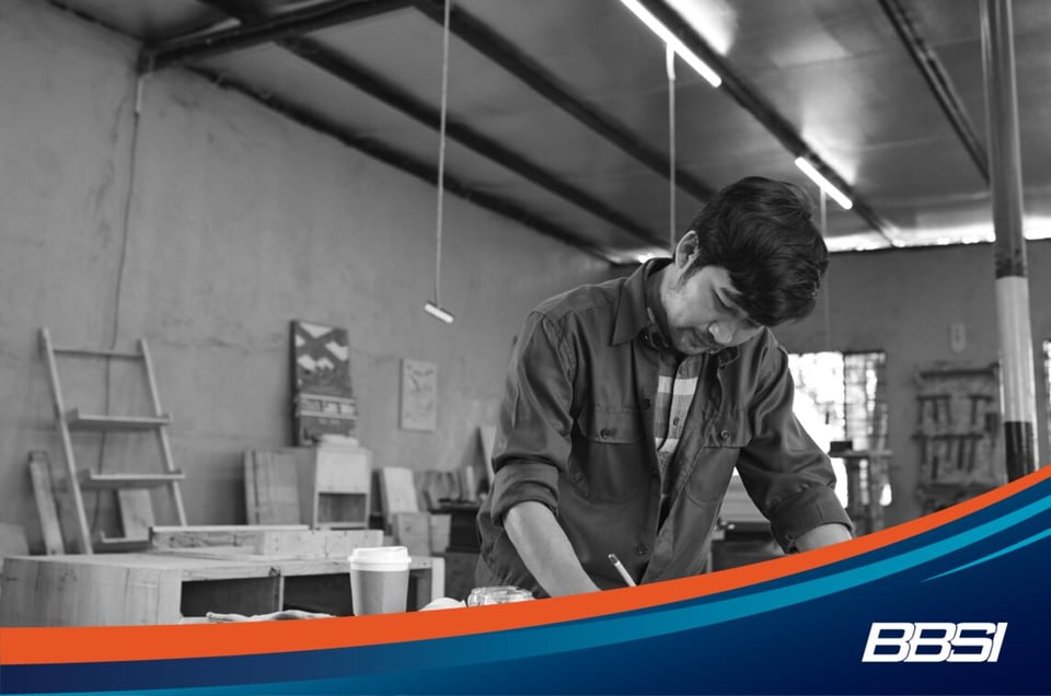 Male carpenter working in a warehouse.