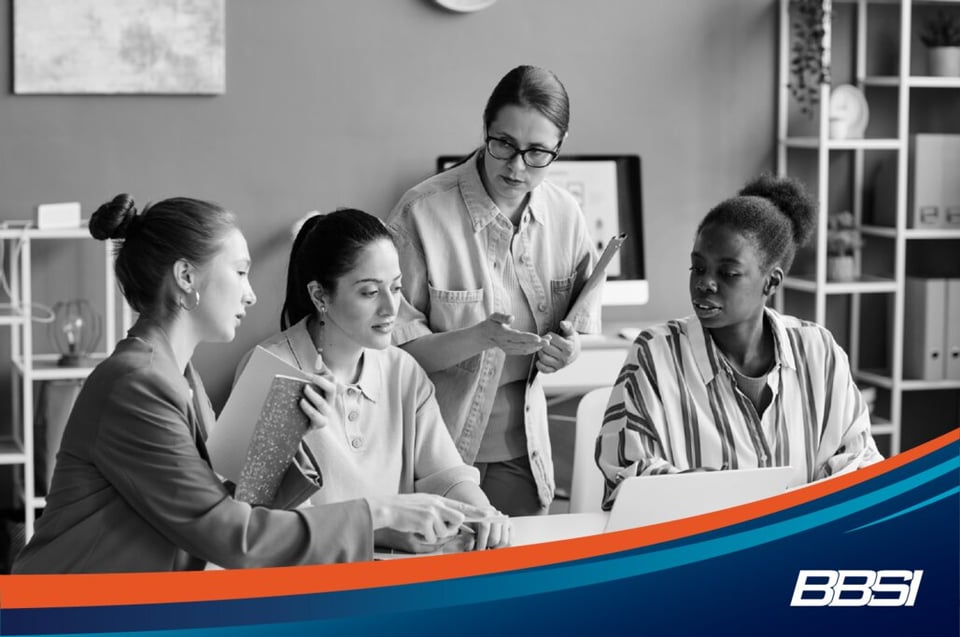 Group of coworkers discussing in an office.