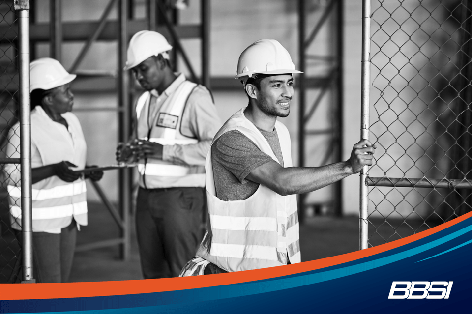 Construction workers wearing hard hats on a job site