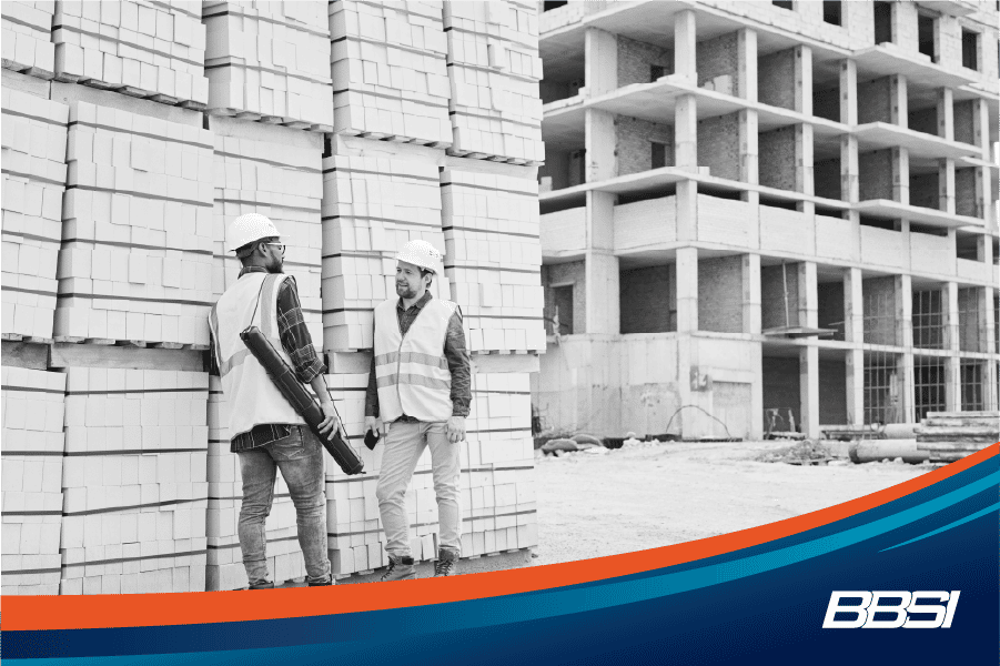 Construction workers discussing main points from a safety meeting