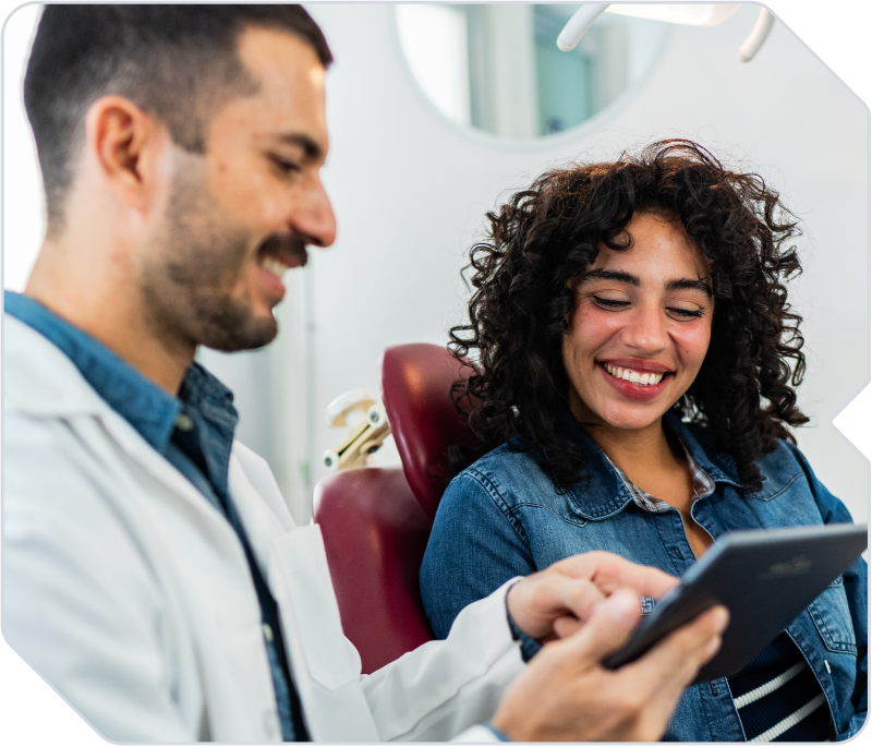A dentist caring for a patient in his dental practice.