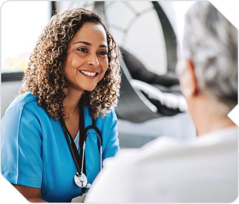 A home healthcare worker caring for an elderly patient.