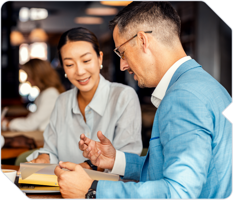 A consultant meeting with a client in a coffeeshop.