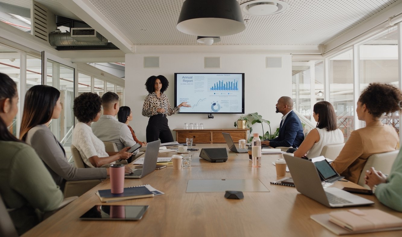 Business people conducting a presentation review meeting in a conference room