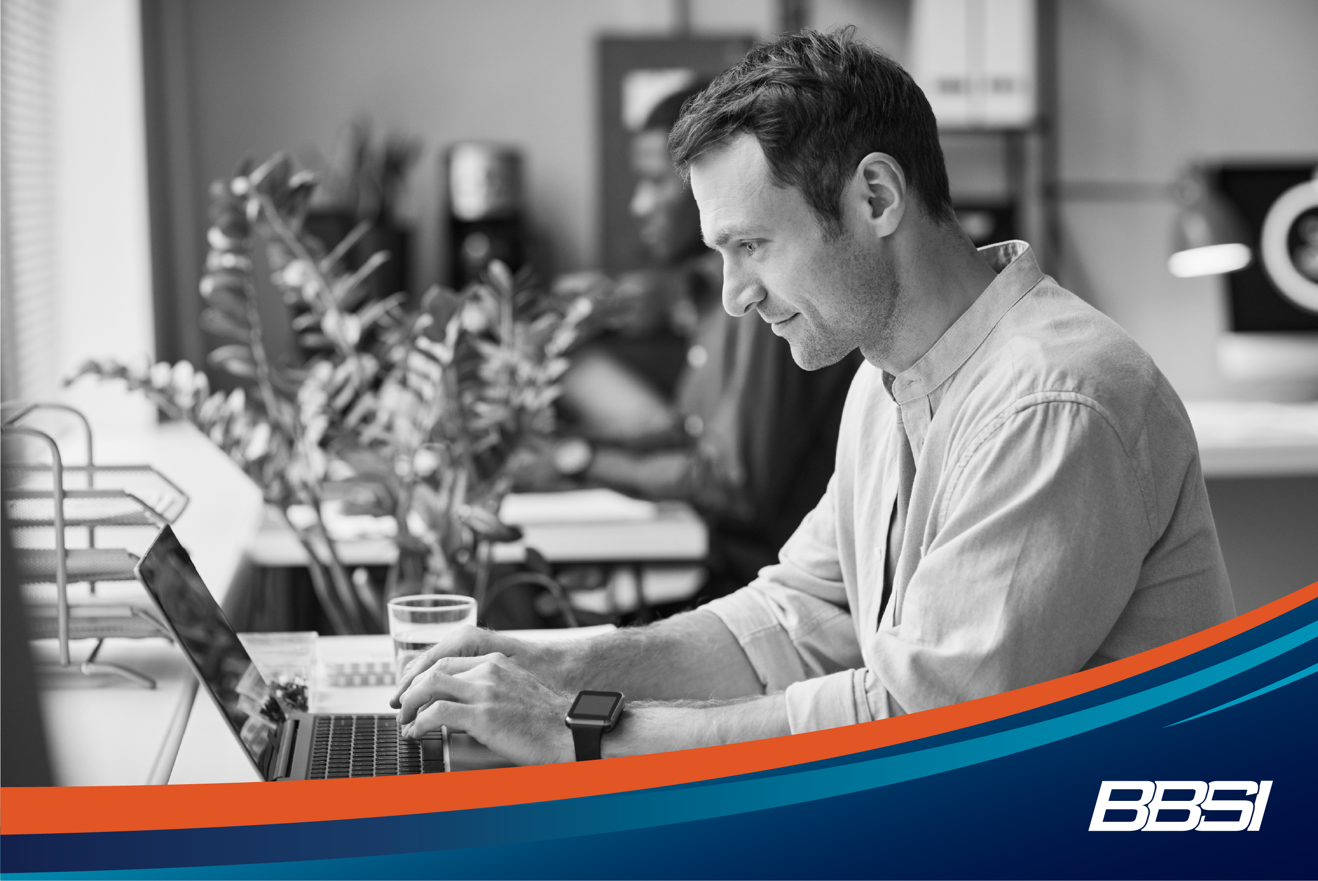 Man Working at Computer in Office Side View