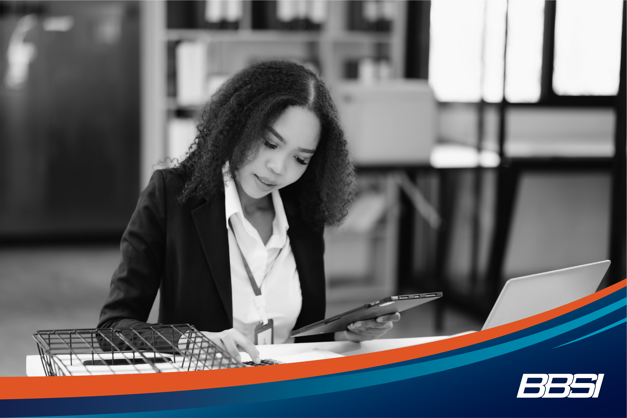 Woman working at a desk calculating her tax deductions