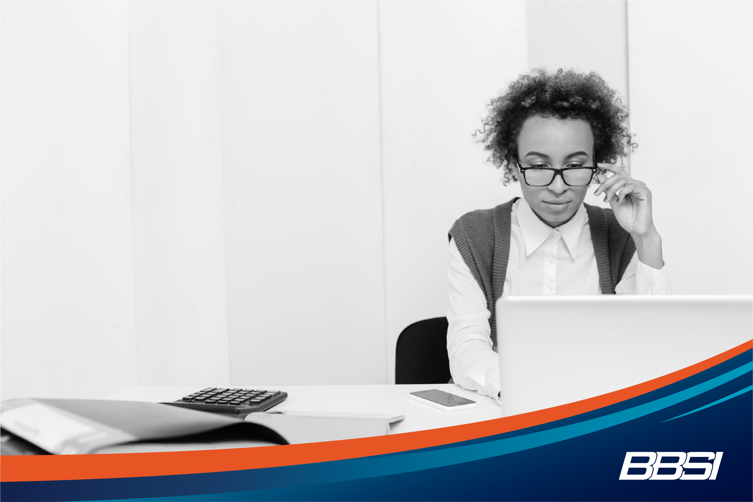 A woman working on her laptop reading about the common small business payroll mistakes