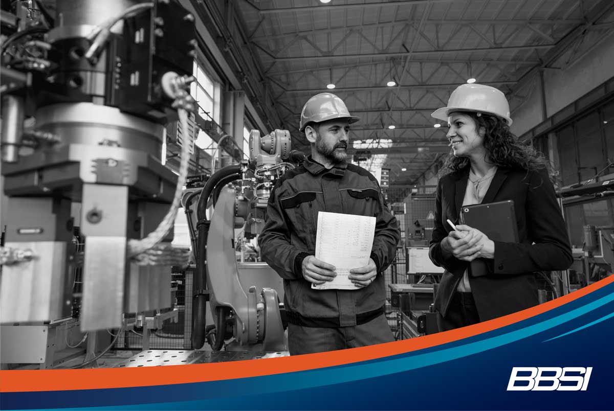Engineering manager and mechanic worker discussing human resource management