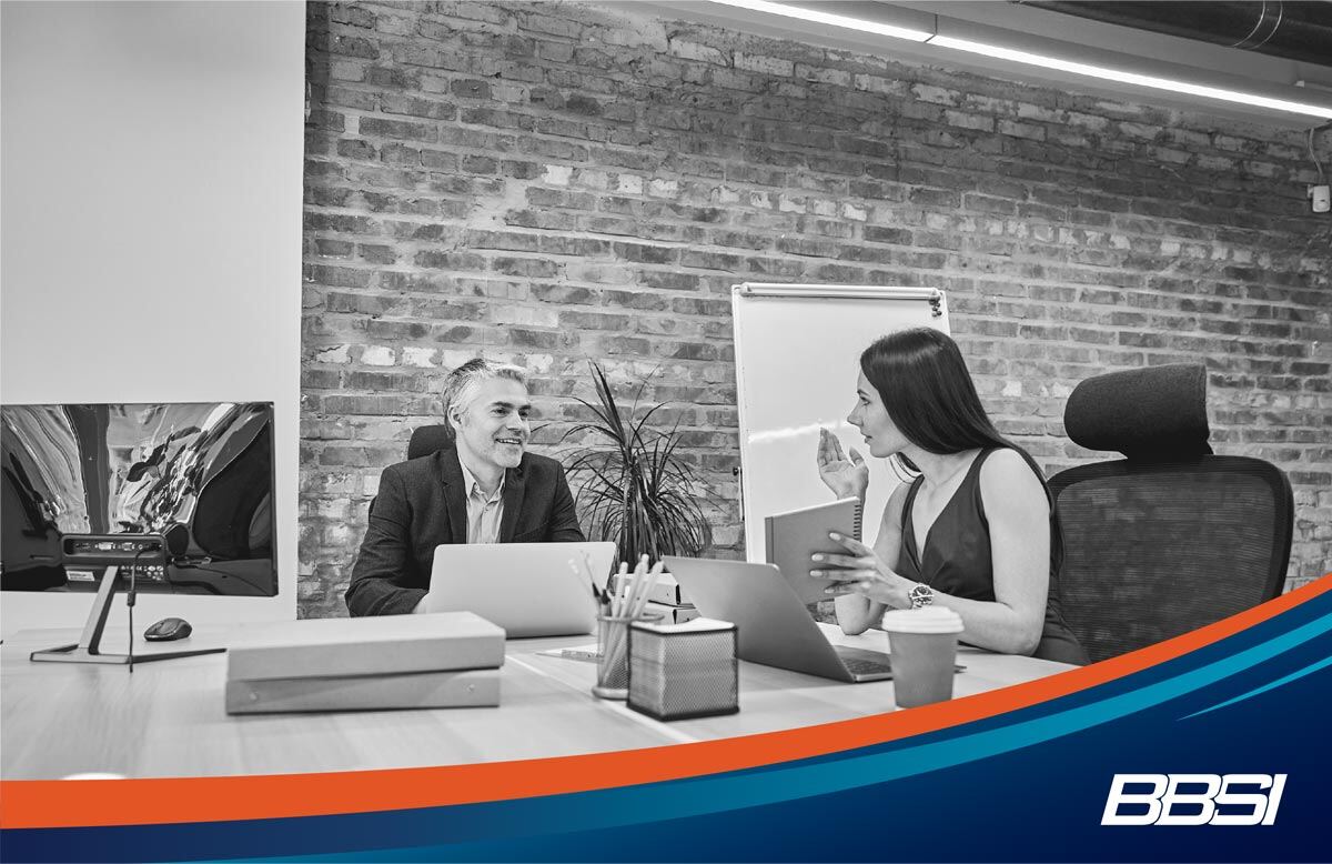 a business women discussing PEO benefits with her client