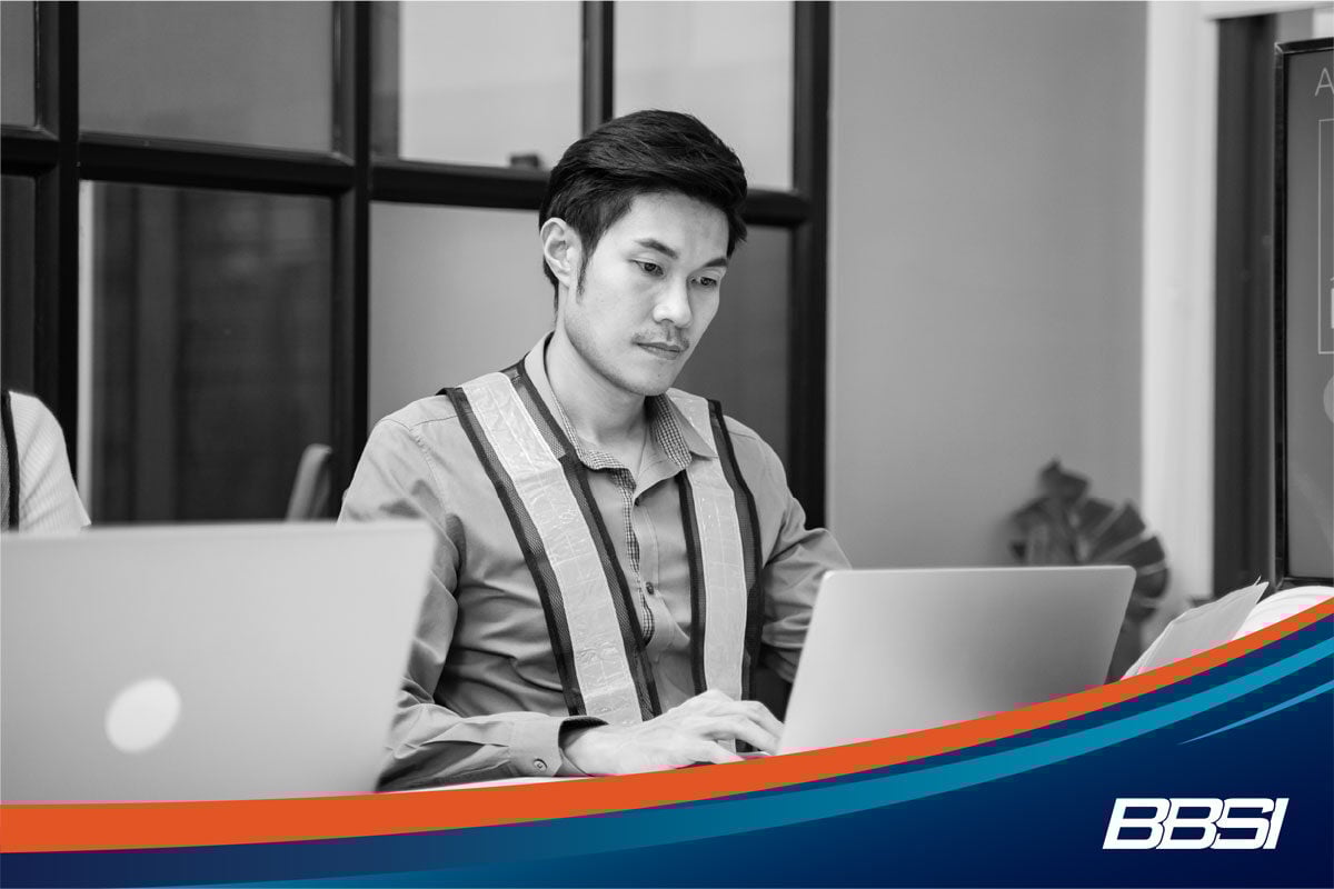 a young man using corporate payroll services