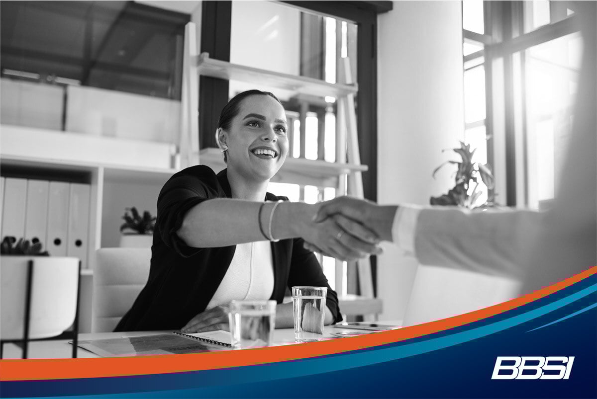 Business owner shaking hands with a new hire