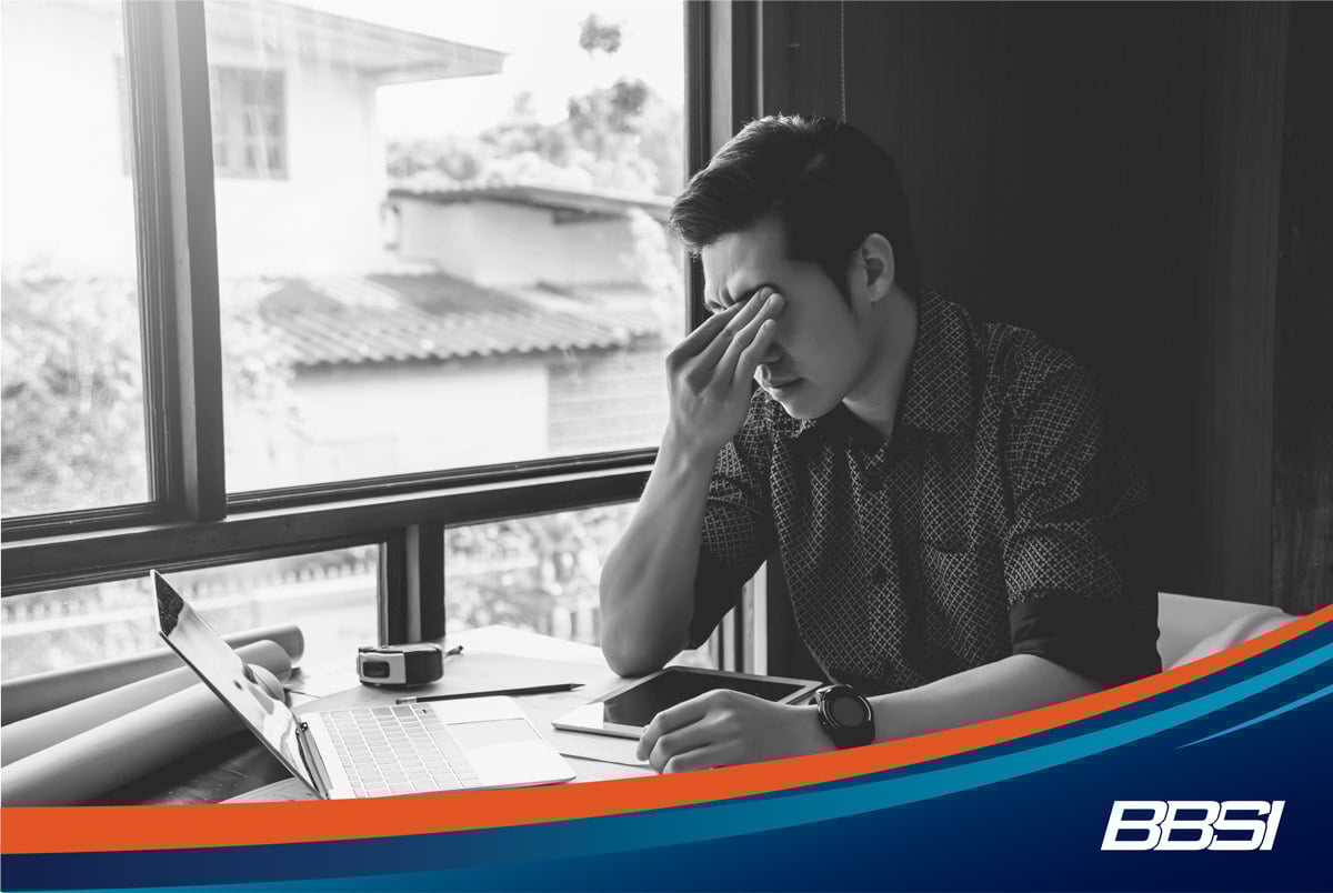 Construction business owner dealing with payroll and HR complications