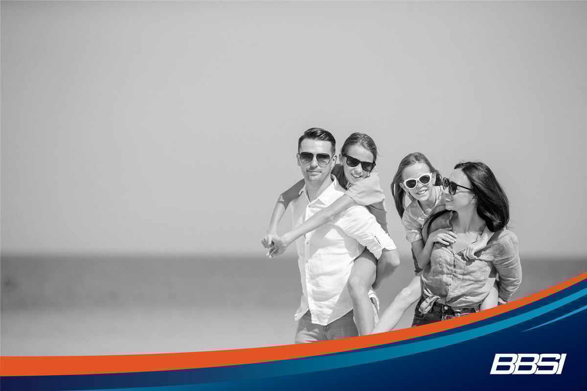  Happy family enjoying their PTO on the beach