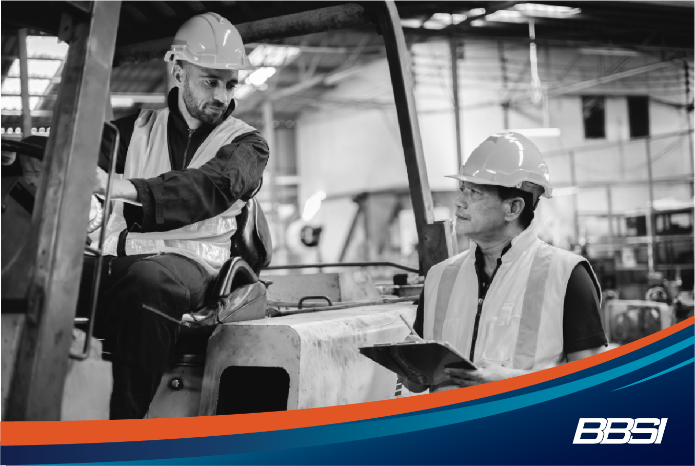 Construction workers discussing workers' compensation coverage on-site