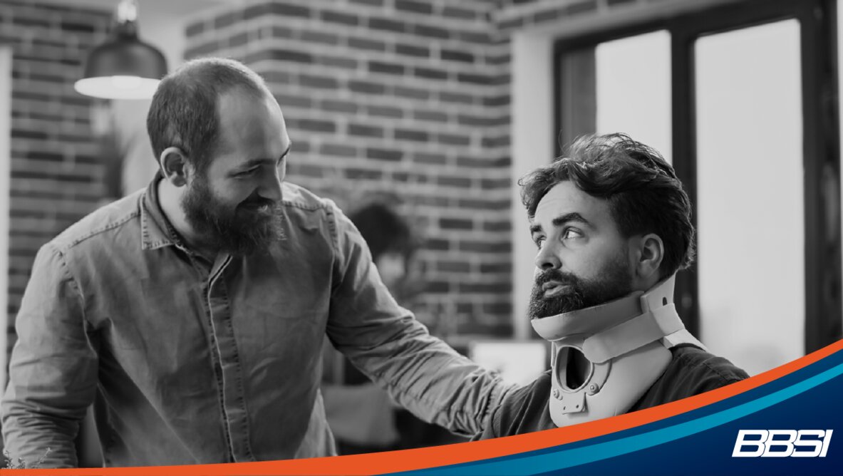 Office employee with neck brace talking to a coworker.