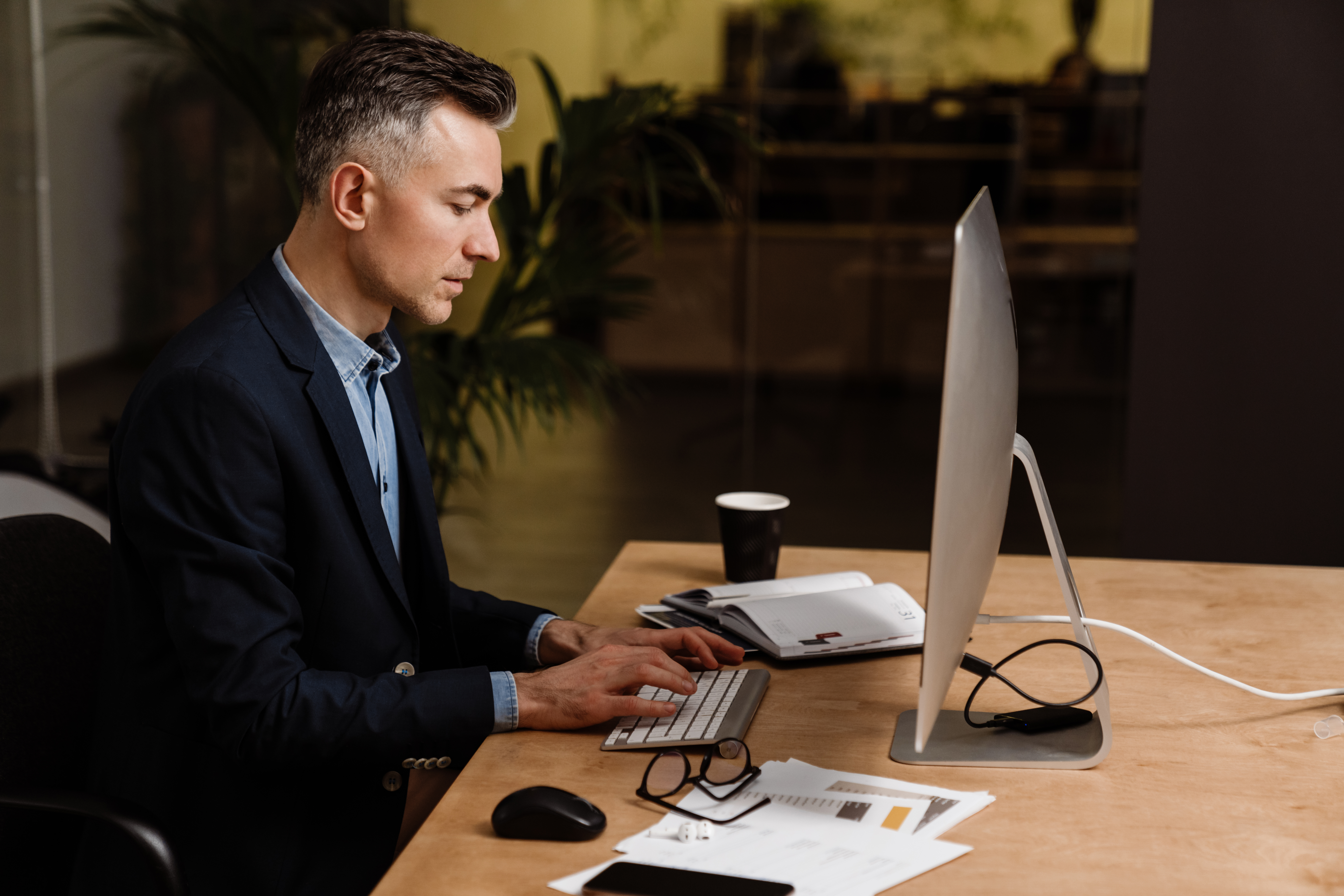 Business owner in corporate office working on their tax filing