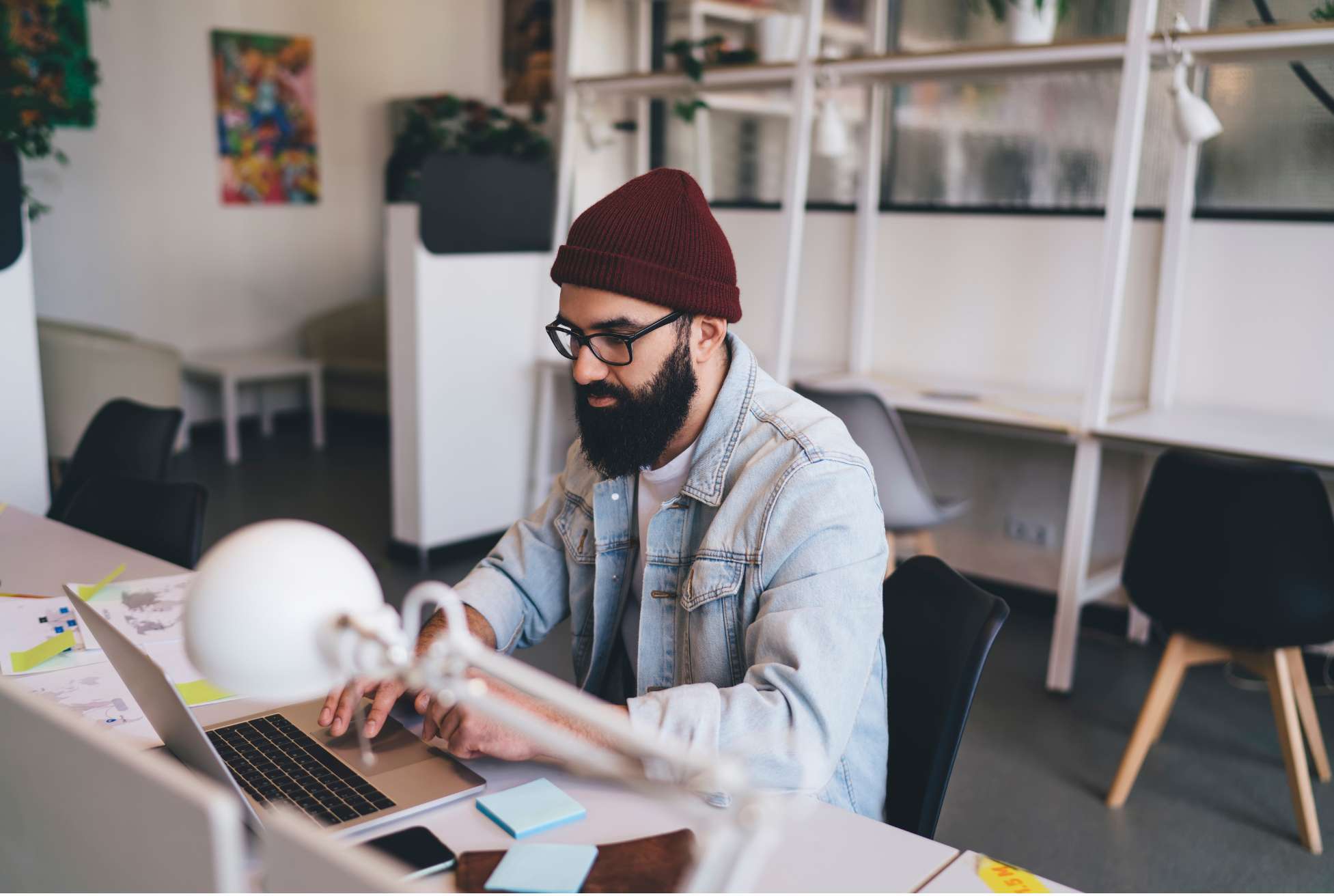 Business owner researching on his laptop for an HRIS Platform