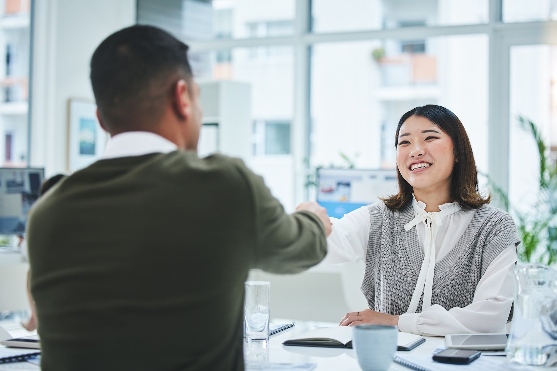 Interviewer shaking hands with the new employee