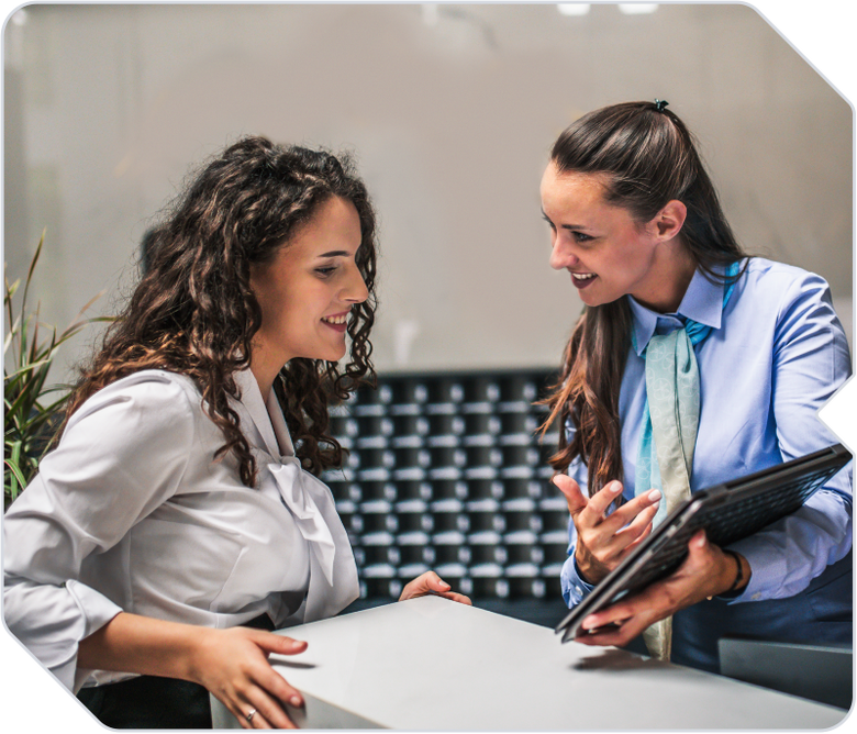 Two women working together in a hospitality company