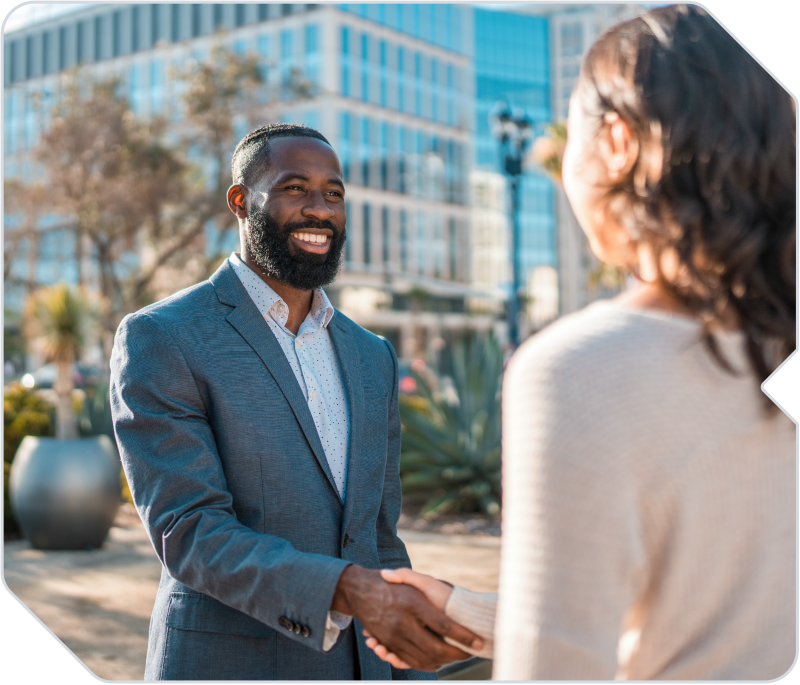 A client meeting a consultant at the entrance of their workplace.