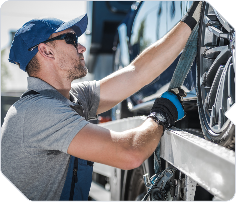 Towing driver out in the field loading up a vehicle