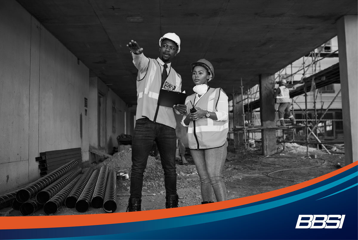 Workers discussing risk management strategies